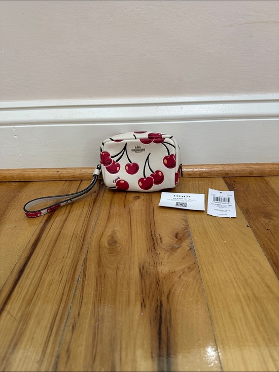 Coach Handbags - NWT Coach Cherry-Print Wristlet in Cream and Red